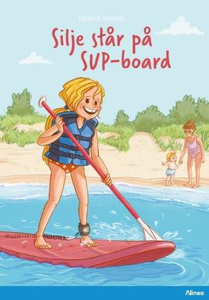 Silje står på SUP-board